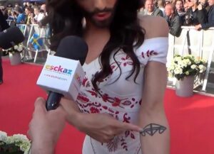 conchita-wurst-tattoo-of-mother-father-brother-initials